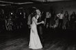 Groom With Bride Wearing Crepe Fit-And-Flare Wedding Dress Juanita Louise By Maggie Sottero