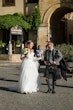 Bride wearing Iris wedding dress by Rebecca Ingram talking with her husband