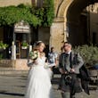 Bride wearing Iris wedding dress by Rebecca Ingram talking with her husband