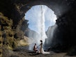 Bride wearing Tuscany Lynette by Maggie Sottero with her husband under a waterfall