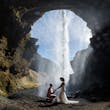 Bride wearing Tuscany Lynette by Maggie Sottero with her husband under a waterfall