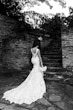 Bride Wearing Lace Backless Wedding Dress Called Chauncey By Sottero And Midgley Walking Up Steps With Groom