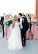 Bride wearing Hattie Lane Marie wedding dress by Rebecca Ingram with groom and bridal party