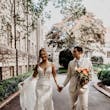 Bride wearing Sydney by Maggie Sottero holding hands with her husband