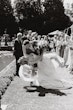 Bride wearing Scarlet by Maggie Sottero being dipped by her husband