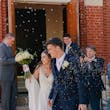 Bride wearing Charlotte by Rebecca Ingram doing their flower petal exit