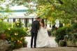 Bride Wearing Simple Ballgown Wedding Dress Called Fortune By Maggie Sottero Kissing Groom