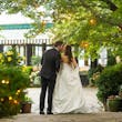 Bride Wearing Simple Ballgown Wedding Dress Called Fortune By Maggie Sottero Kissing Groom