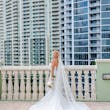 Bride Wearing Lace Mermaid Wedding Dress Called Bronson By Sottero And Midgley On A City Balcony