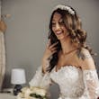 Bride wearing Ryker wedding dress by Sottero and Midgley holding bouquet