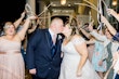 Groom Kissing Bride Wearing A-Line Wedding Dress Called Wallis by Maggie Sottero