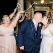Groom Kissing Bride Wearing A-Line Wedding Dress Called Wallis by Maggie Sottero