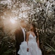 Real Bride wearing A-Line wedding dress with tiered ruffled called Lettie by Rebecca Ingram.