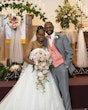 Groom With Bride Wearing White Lace Ball Gown 