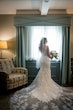 Bride Wearing Embellished Vintage-Inspired Lace Sheath Wedding Dress Called Delilah By Maggie Sottero