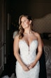 Bride Wearing Lace Mermaid Wedding Gown Called Montgomery By Sottero and Midgley Getting Ready