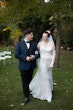 Bride wearing Kern by Maggie Sottero walking with her husband