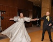 Bride wearing Juniper by Sottero and Midgley with her husband dancing