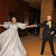 Bride wearing Juniper by Sottero and Midgley with her husband dancing