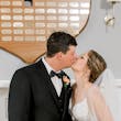 Bride wearing Florence wedding dress by Maggie Sottero kissing her husband