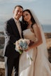 Bride wearing Aspen by Sottero and Midgley standing with her husband