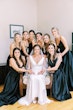 Bride wearing simple crepe wedding dress Bertina by Maggie Sottero.