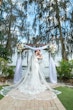 Bride In Off The Shoulder Lace Wedding Dress Called Edison By Maggie Sottero With Groom