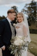 Bride wearing Yates wedding dress by Maggie Sottero with her husband