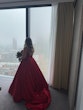 Bride Wearing Red Aline Wedding Dress Called Scarlet By Maggie Sottero Looking Out A Window