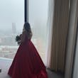 Bride Wearing Red Aline Wedding Dress Called Scarlet By Maggie Sottero Looking Out A Window