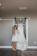 Bride Getting Ready to put on Glittery Mermaid Wedding Gown with Plunging Illusion Sweetheart Neckline  by Maggie Sottero