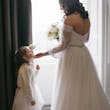 Bride wearing Nerida by Sottero and Midgley with her flower girl