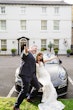 Bride wearing Tuscany Lynette embracing her husband