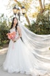 Bride wearing Casey by Maggie Sottero with a veil