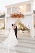 Bride wearing Casey by Maggie Sottero kissing her husband