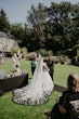 Bride Wearing Gothic Black Lace Wedding Dress Called Tristyn By Maggie Sottero With Groom At The Ceremony