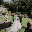 Bride Wearing Gothic Black Lace Wedding Dress Called Tristyn By Maggie Sottero With Groom At The Ceremony