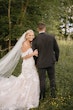 Bride wearing Hattie Lynette by Rebecca Ingram and her husband