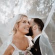 Bride wearing Mindel wedding dress by Maggie Sottero with her husband