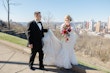 Bride wearing Riviera by Sottero and Midgley walking with her husband