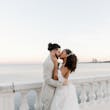 Bride wearing Lettie by Rebecca Ingram kissing her husband