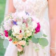 Bride In White Wedding Dress Named Shasta By Sottero and Midgley With Veil And Pink Flowers