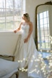 Bride wearing Selena by Maggie Sottero looking out the window