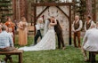 Bride Wearing Lace Wedding Dress Called Ladonna By Maggie Sottero Kissing Groom