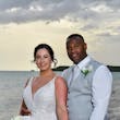 Bride wearing Franklynn by Sottero and Midgley with her husband on the beach