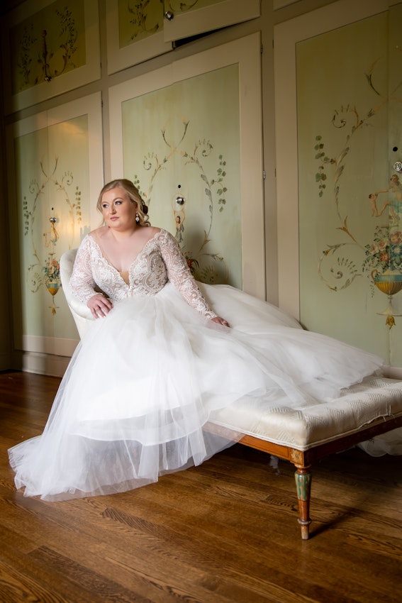Bride Laying On Chaise Lounge Wearing Bridal Dress Called Mallory Dawn by Maggie Sottero