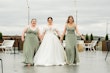 Bride wearing Derrick by Maggie Sottero walkign with her bridesmaids