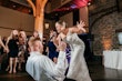 Bride Wearing Square Neck Wedding Dress Called Albany By Maggie Sottero Singing To The Groom At The Reception