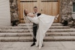 Bride wearing Paxton by Maggie Sottero being held by her husband