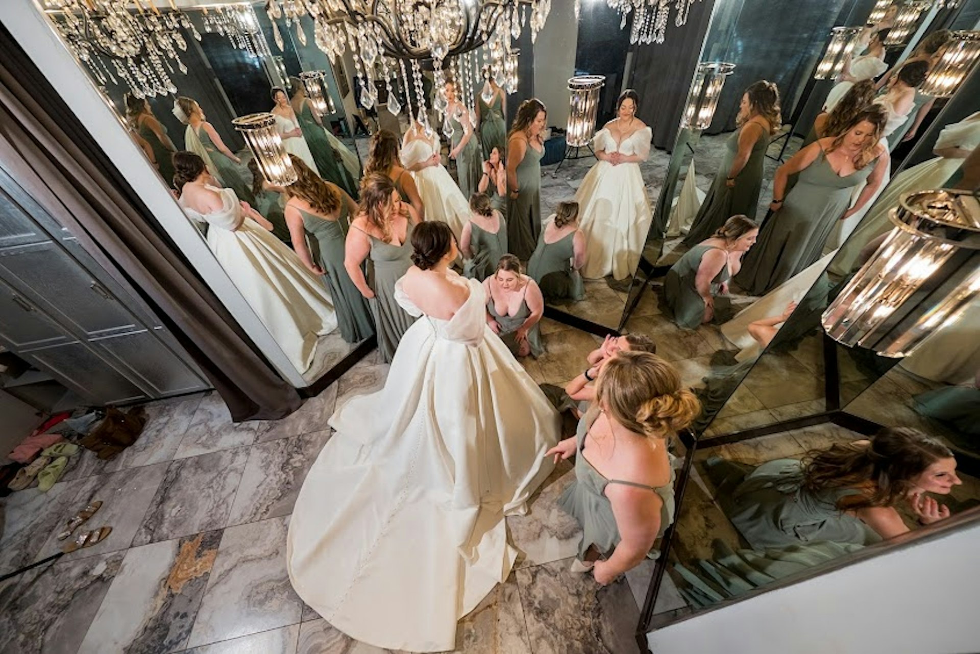 Bride wearing Derrick by Maggie Sottero surrounded by her bridesmaids